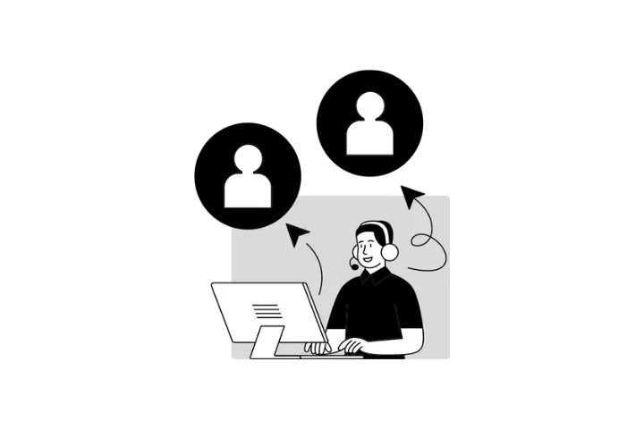 Hands using a laptop and smartphone.